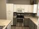Beautiful kitchen boasts modern appliances, spacious countertops, and ample cabinet storage at 21214 N 80Th Ln, Peoria, AZ 85382