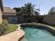 Private pool with artificial turf, concrete decking and block wall surround at 21214 N 80Th Ln, Peoria, AZ 85382