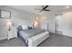 Inviting bedroom featuring plush carpeting, a ceiling fan, and a well-lit ambiance with a walk-in closet at 21930 N 29Th St, Phoenix, AZ 85050