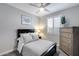 Bright bedroom with a modern gray color scheme, queen bed, and plantation shutters at 21930 N 29Th St, Phoenix, AZ 85050