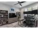 Bright home office featuring two monitors, neutral paint, and organized shelving with books at 21930 N 29Th St, Phoenix, AZ 85050