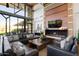 Comfortable lounge area with a modern fireplace, large TV, and stylish decor at 21930 N 29Th St, Phoenix, AZ 85050