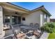 Cozy outdoor space featuring dining, seating, fan, TV, and sliding glass doors at 21930 N 29Th St, Phoenix, AZ 85050