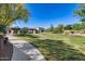 Community park featuring green grass, sidewalks, trees, picnic area, and landscaping at 21930 N 29Th St, Phoenix, AZ 85050