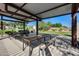 Outdoor picnic area featuring tables, benches, shade structure, and grassy area at 21930 N 29Th St, Phoenix, AZ 85050