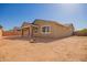 Backyard view of home showing fire pit and covered patio, promoting outdoor living at 2464 N Morrison Ave, Casa Grande, AZ 85122
