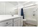 Bright bathroom features a white vanity, toilet, and shower/tub combo with tiled walls at 2464 N Morrison Ave, Casa Grande, AZ 85122