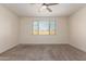 Bright and airy bedroom with carpet, ceiling fan, and window offering natural light at 2464 N Morrison Ave, Casa Grande, AZ 85122