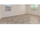 Bedroom features two windows with blinds and tile flooring at 2464 N Morrison Ave, Casa Grande, AZ 85122