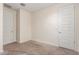 A neutral bedroom features two doors and carpeted floors at 2464 N Morrison Ave, Casa Grande, AZ 85122
