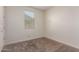 Neutral bedroom features a window with blinds and carpeted floors at 2464 N Morrison Ave, Casa Grande, AZ 85122