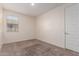 Neutral bedroom features a window and neutral carpet, providing a blank canvas at 2464 N Morrison Ave, Casa Grande, AZ 85122