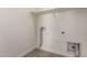 Well-lit laundry room showcasing tile floor and hookups for appliances and extra storage space at 2464 N Morrison Ave, Casa Grande, AZ 85122