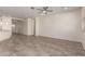 Open-concept living room with tile flooring, recessed lighting, and seamless transition to kitchen at 2464 N Morrison Ave, Casa Grande, AZ 85122