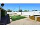 Backyard featuring turf, sandbox and covered patio at 2614 W Greenway Rd, Tempe, AZ 85282