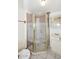 Bathroom showcasing a glass corner shower enclosure, vanity with white sink, and tile flooring at 2614 W Greenway Rd, Tempe, AZ 85282