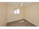 Bedroom with wood-look flooring, ceiling fan, a window, and neutral wall paint at 2614 W Greenway Rd, Tempe, AZ 85282