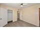 Comfortable bedroom featuring light wood flooring and ample closet space for storage at 2614 W Greenway Rd, Tempe, AZ 85282