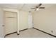 Bedroom featuring tile floor and a white door at 2614 W Greenway Rd, Tempe, AZ 85282