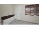 Bright entryway featuring tile flooring, a granite topped cabinet and window at 2614 W Greenway Rd, Tempe, AZ 85282