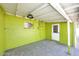 Laundry room boasts green walls, overhead lighting, and utility hookups for convenience at 2614 W Greenway Rd, Tempe, AZ 85282