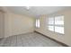 Inviting living area with neutral paint, tile floors, and abundant natural light at 2614 W Greenway Rd, Tempe, AZ 85282