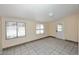 Spacious living area featuring tile floors and natural light from multiple windows at 2614 W Greenway Rd, Tempe, AZ 85282