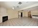 Spacious living room with tiled flooring, fireplace, and abundant natural light at 2614 W Greenway Rd, Tempe, AZ 85282