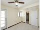 Spacious room showing tiled floor, door to exterior, window and passage to ensuite bathroom at 2614 W Greenway Rd, Tempe, AZ 85282
