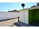 Outdoor shed with white paneling, a block wall, and brick trim offers extra storage at 2614 W Greenway Rd, Tempe, AZ 85282