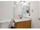 Compact bathroom featuring a single sink with vanity, mirror, toilet, and ample lighting at 263 S Del Rancho --, Mesa, AZ 85208