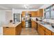 Bright kitchen with oak cabinets, stainless steel appliances and double oven featuring ample counter space at 263 S Del Rancho --, Mesa, AZ 85208