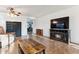 Spacious living room with tile flooring, comfortable seating, a fireplace and a large flat-screen TV at 263 S Del Rancho --, Mesa, AZ 85208