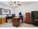 Home office with neutral carpet, two desks, and a window providing natural light for productivity at 263 S Del Rancho --, Mesa, AZ 85208