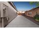 Spacious side yard with a long concrete driveway and clean design, offering ample space and functionality at 263 S Del Rancho --, Mesa, AZ 85208