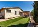 Beautiful backyard with a putting green and shaded pergola, creating an inviting outdoor oasis at 2731 E Cherry Hill Dr, Gilbert, AZ 85298