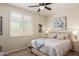 This bedroom features a ceiling fan, plantation shutters, and neutral paint at 2731 E Cherry Hill Dr, Gilbert, AZ 85298