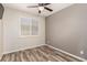 This bedroom features a ceiling fan and wood-look flooring at 2731 E Cherry Hill Dr, Gilbert, AZ 85298