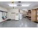 Spacious garage with shelving and storage, providing ample room for vehicles and projects at 2731 E Cherry Hill Dr, Gilbert, AZ 85298