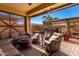 Inviting outdoor living space with comfortable seating and a view of the well-manicured backyard at 2731 E Cherry Hill Dr, Gilbert, AZ 85298