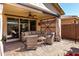 Cozy covered patio with comfortable seating, creating a relaxing outdoor living space at 2731 E Cherry Hill Dr, Gilbert, AZ 85298
