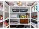 Organized pantry with white shelves and various food items and storage containers at 2731 E Cherry Hill Dr, Gilbert, AZ 85298