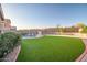 Expansive backyard with a sparkling pool, lush landscaping, and recreational area at 29227 N 44Th St, Cave Creek, AZ 85331