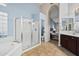 Bright bathroom featuring a glass shower, a large tub, and tasteful tile work at 29227 N 44Th St, Cave Creek, AZ 85331