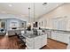 Spacious kitchen features a large island, stainless steel appliances, and seamless flow to the living area at 29227 N 44Th St, Cave Creek, AZ 85331