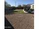 Lawn with desert landscaping and an outdoor seating area perfect for relaxing and entertaining at 3012 N 310Th Ln, Buckeye, AZ 85396