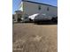 Zero maintenance yard with desert landscaping, seating area, and small grassy area at 3012 N 310Th Ln, Buckeye, AZ 85396