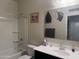 Bathroom features a single sink vanity, a large mirror, a toilet and shower/tub combo at 3012 N 310Th Ln, Buckeye, AZ 85396