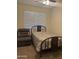 This bedroom features neutral walls and carpet, a chair, and a window bringing in natural light at 3012 N 310Th Ln, Buckeye, AZ 85396