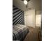This bedroom offers a ceiling fan, closet, and carpet flooring at 3012 N 310Th Ln, Buckeye, AZ 85396